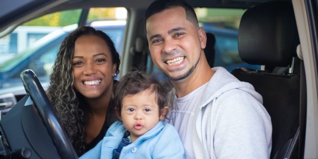 family sitting in car