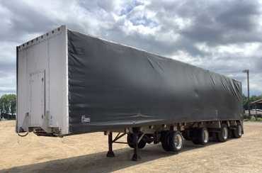 2004 Reitnouer Quad-axle Aluminum Flatbed with Chameleon Rolling Tarp System