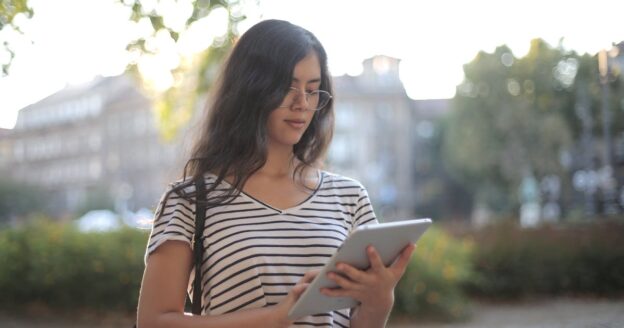 person looking at car reports online