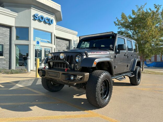 repo vehicle deal with vehicle for sale in front of a local credit union