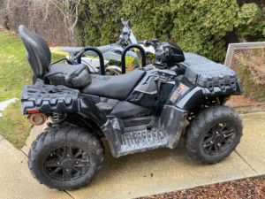 repo 2024 Polaris Sportsman 850 Touring for sale at a bank